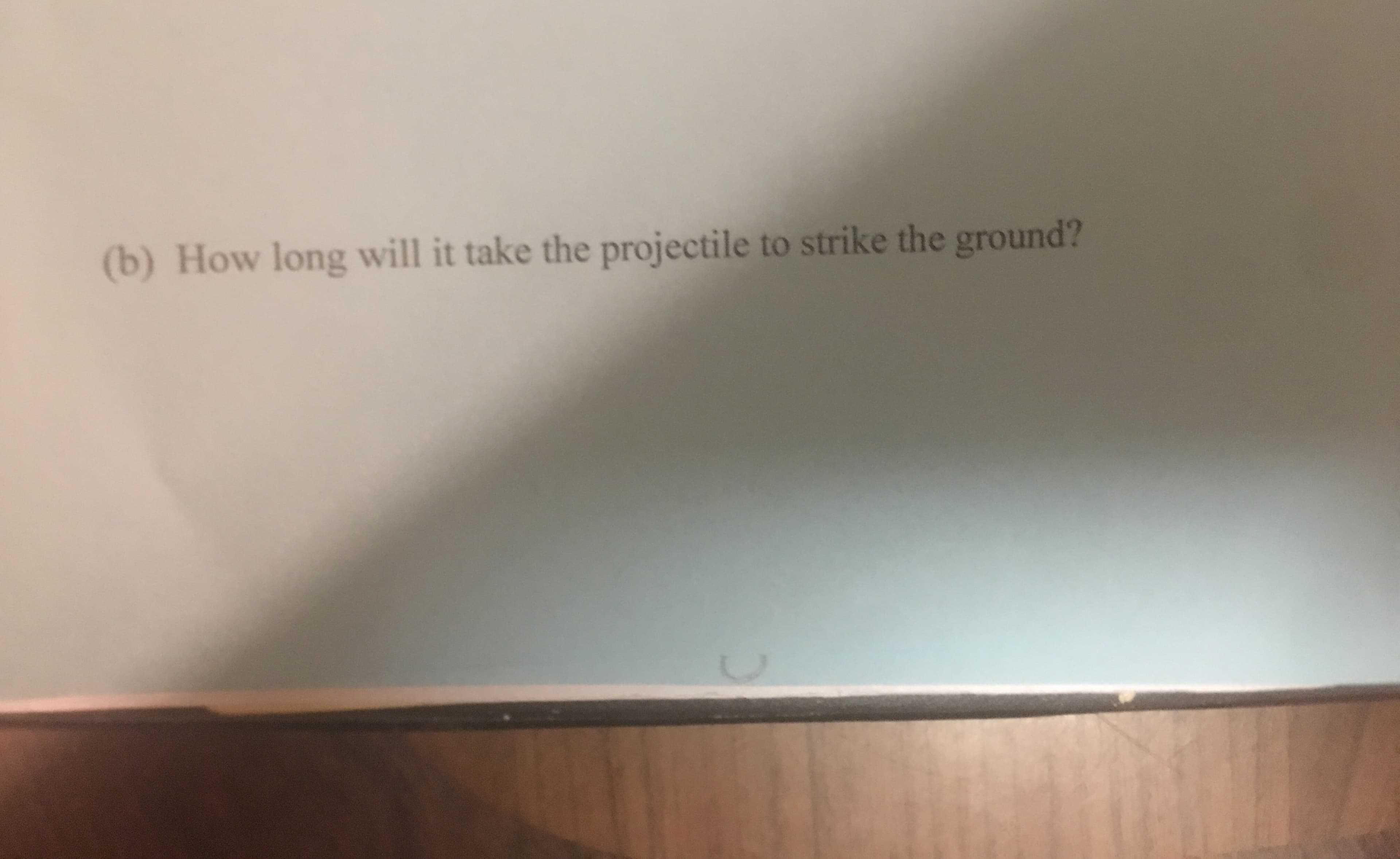 (b) How long will it take the projectile to strike the ground?
