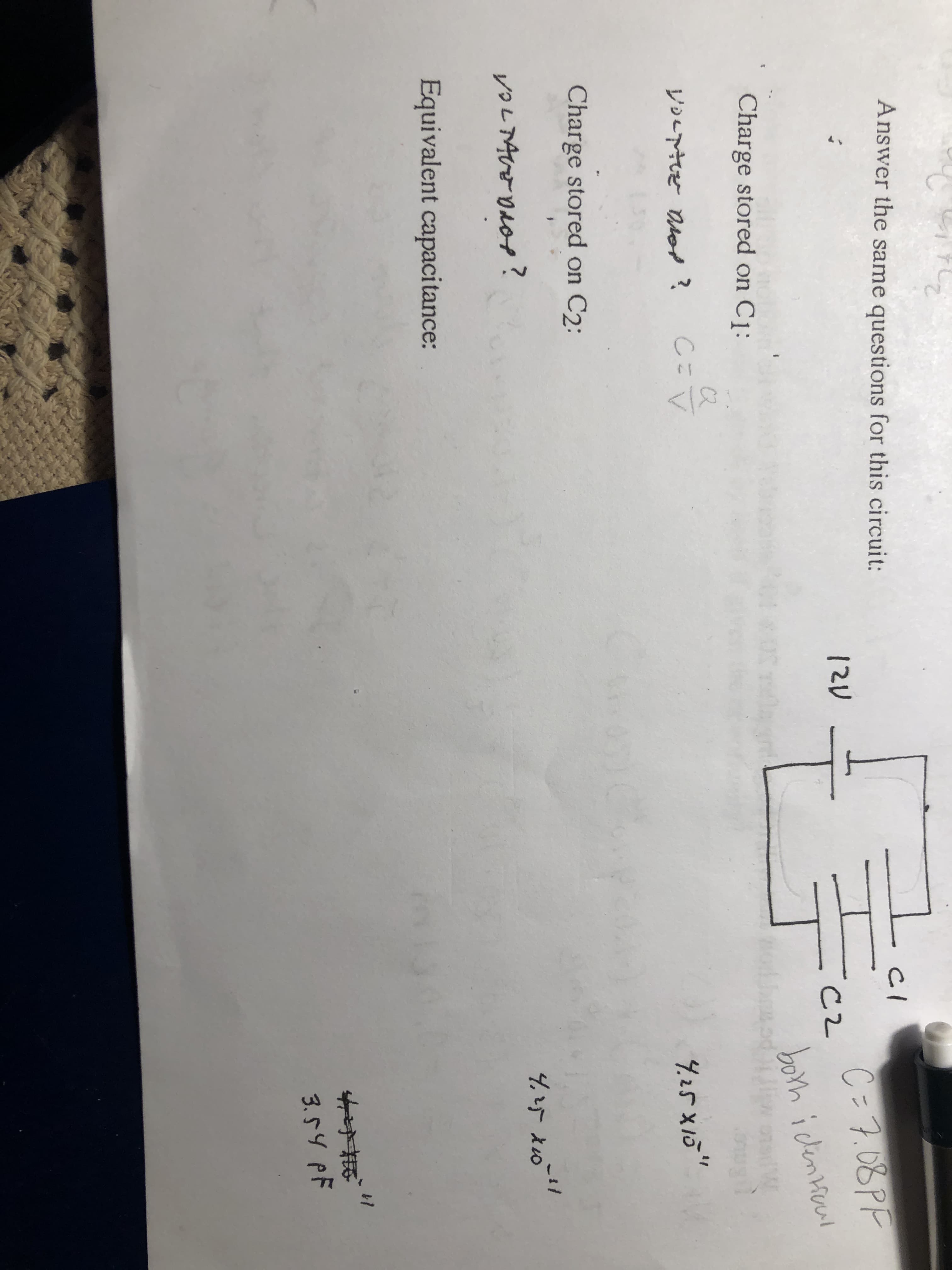 Answer the same questions for this circuit:
12U
C =7.08PF
Charge stored on C1:
both i denticul
Vocpte Dot?
Y,25x10
Charge stored on C2:
VOLTAVO DAos
Equivalent capacitance:
3. S4 pF
