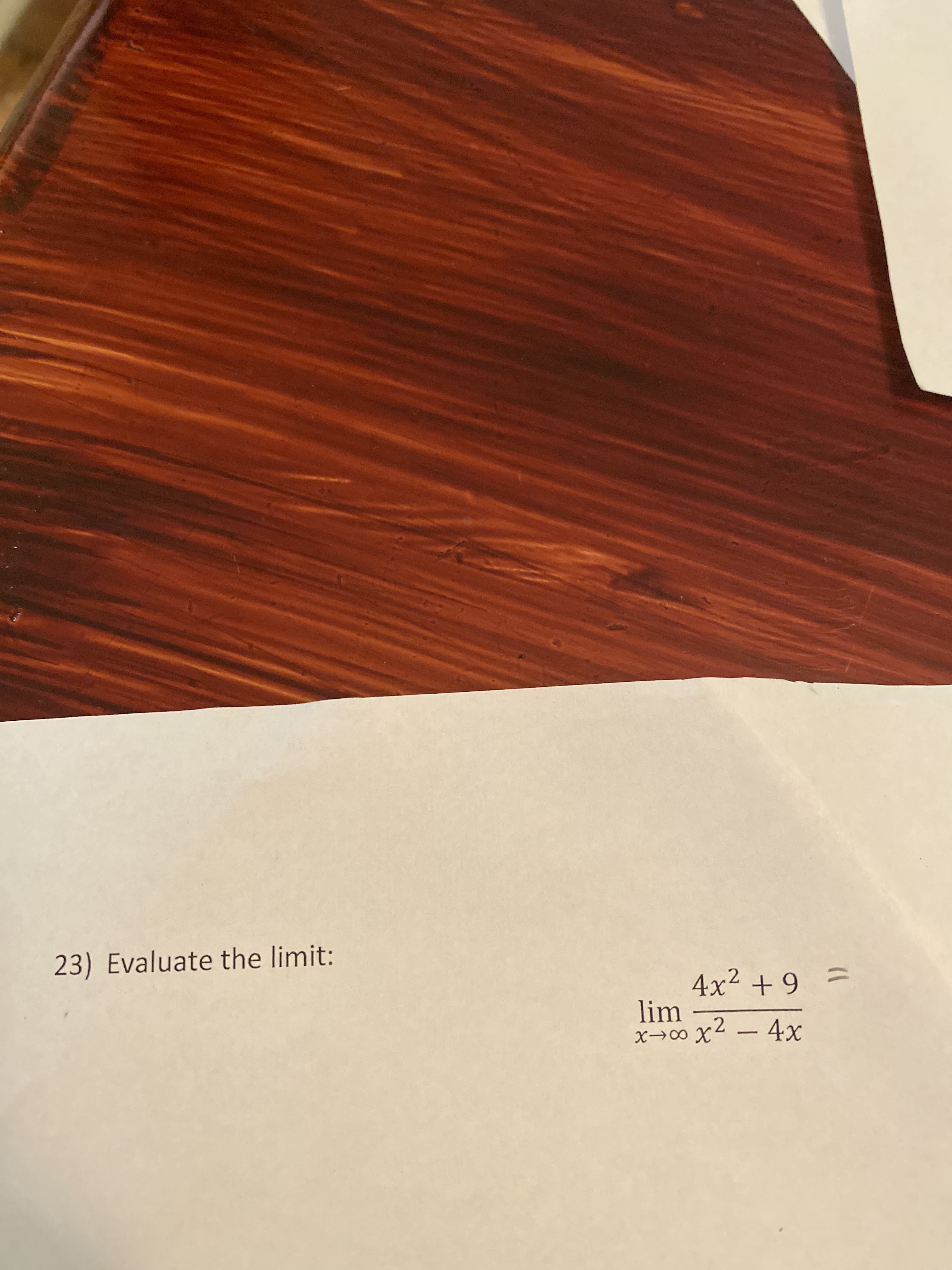 23) Evaluate the limit:
4x² + 9
lim
x→∞ x² – 4x
