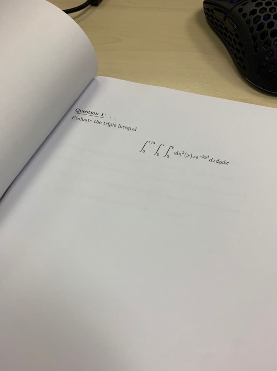 Question 1:2
Evaluate the triple integral
sin² (2)ze-v³ dzdydz