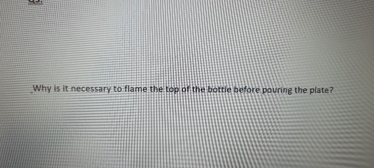 Why is it necessary to flame the top of the bottle before pouring the plate?
